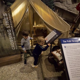 Children Exploring Railroad History Museum Exhibit