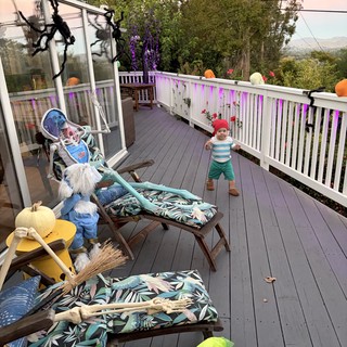 Halloween Decorated Deck with Toddler in Fog