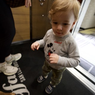 Young Child in Mickey Mouse Shirt in Hotel Elevator