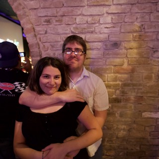 Couple Embracing at Austin Bar Karaoke Night