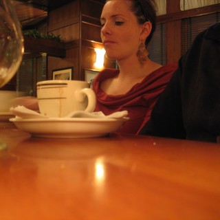Quiet Contemplation Over Coffee at a Restaurant
