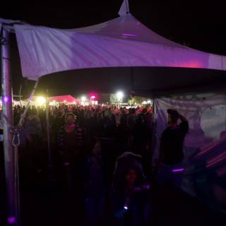 Nighttime Crowd Under Tent at Coachella