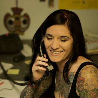 Tattooed Woman on the Phone