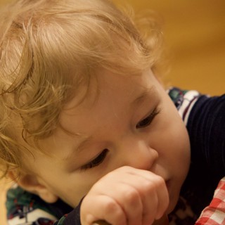 Young Child in Quiet Contemplation on Christmas Morning