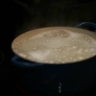 Boiling Cup of Coffee on a Stove