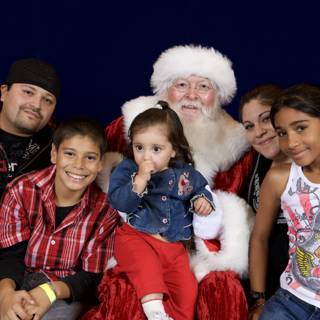 Smiling Faces and Santa Claus at APC Christmas Party