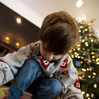 Child Opening Presents on Christmas Morning