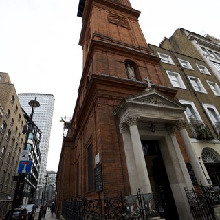Historic Red Brick Church Tower Rising Above London Street