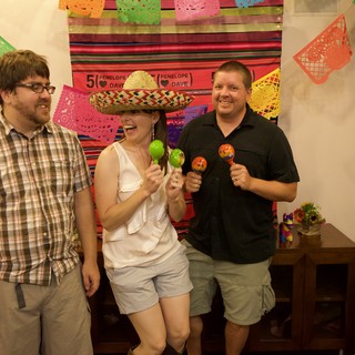 Friends Celebrate with Maracas at Fiesta Anniversary Party