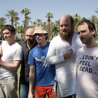 Group of Men Enjoying Coachella in the Park