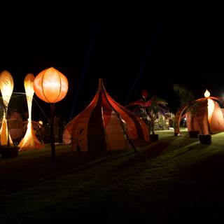 Glowing Tents under the Night Sky
