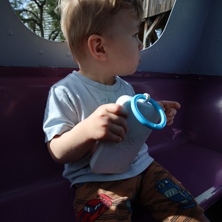 Toddler with Sippy Cup at Playground