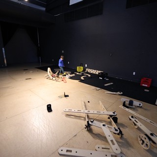 Assembly in Progress at Dark Exhibition Space