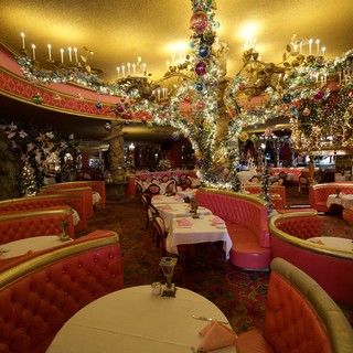 Lavish Christmas Decorated Restaurant Interior with Ornate Chandeliers