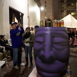 Purple Barrel with a Face on Display