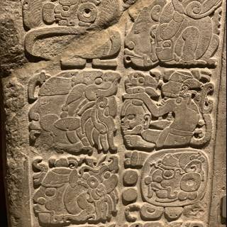 Ancient Stone Carving Depicting Animals and People