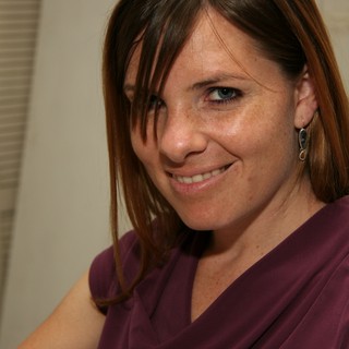 Warm Smile Portrait of Woman in Purple Top