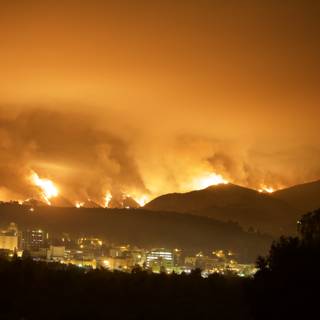 Station Fire Rages in the Hills Above the Cityscape