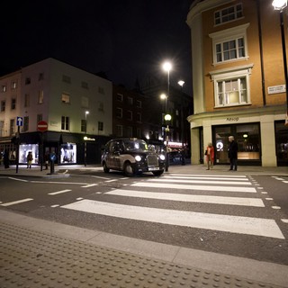 London Black Cab at Night Zebra Crossing