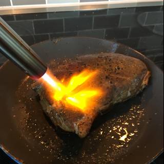 Flame-grilled Steak on a Cooking Pan
