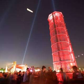 The Red Tower Illuminates the Night Sky