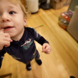 Curious Toddler in Kitchen on Christmas Morning