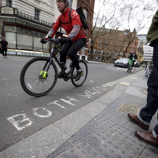 Urban Cyclist Navigating London City Streets