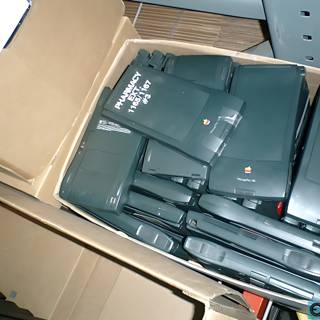 Electronic Devices in Their Container