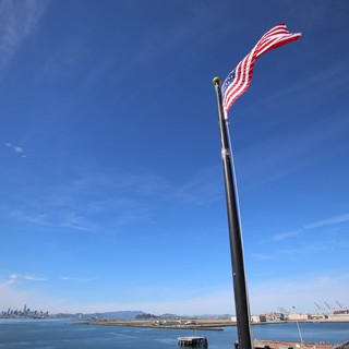 American Flag Flying Above San Francisco Bay Harbor