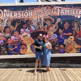 Couple Posing in Front of Family Mural