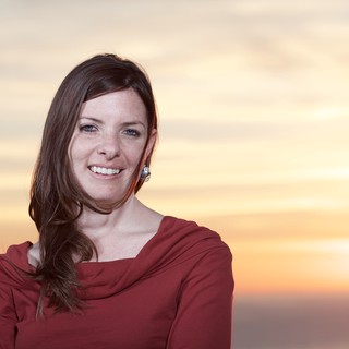 Smiling Woman Bathed in Golden Sunset Light