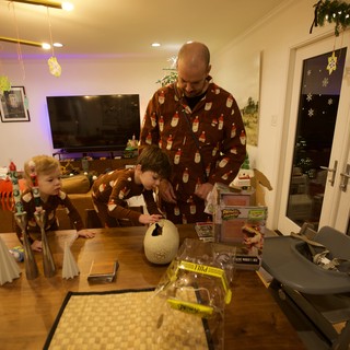 Father and Children Creating Christmas Crafts Together