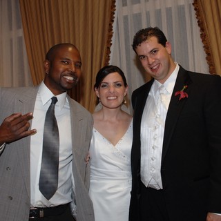 Joyful Wedding Celebration with Bride, Groom, and Guest