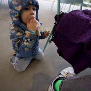 Toddler Enjoying Ice Cream at Outdoor Cafe