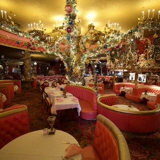 Opulent Crystal Chandelier in Lavish Pink Restaurant Interior