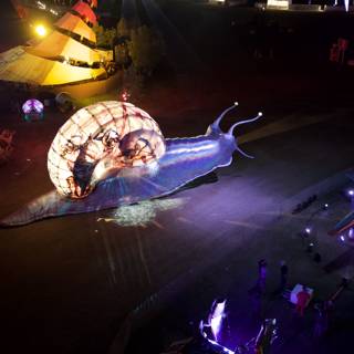 Glowing Snail Stuns Coachella Crowd