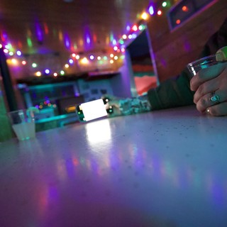 Festive Evening at a Colorfully Lit Bar