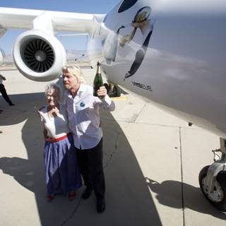 Richard Branson and team beside the White Knight Two airplane