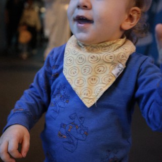 Toddler in Blue Shirt with Smiley Face Bandana