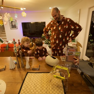 Family Christmas Morning Unwrapping Presents Together