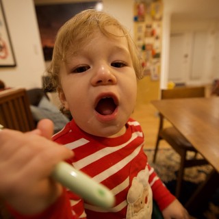 Toddler's Excited Mealtime Moment at Home