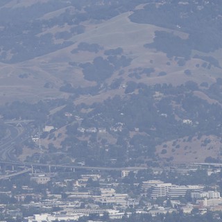 Smoky Haze Over Bay Area Freeway Interchange and Hills