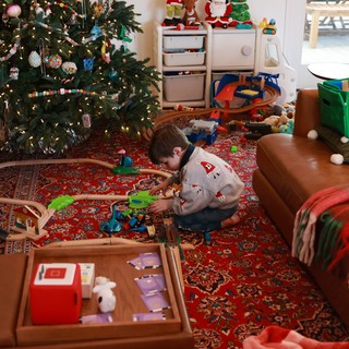 Child Playing with Train Set on Christmas Morning