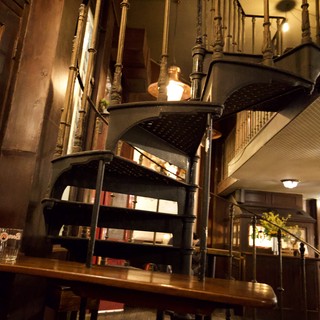 Atmospheric Interior of Historic London Bookshop with Spiral Staircase