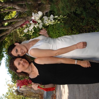Bride and Friend Celebrate Wedding Day Outdoors