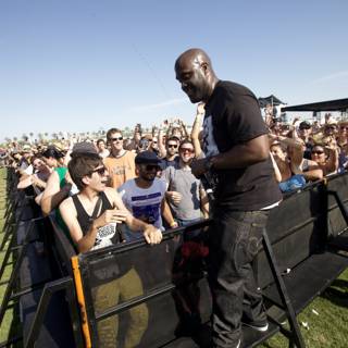 Man in Black Shines under Blue Sky at Coachella Sunday