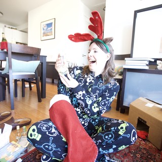 Joyful Christmas Morning in Reindeer Pajamas and Antlers