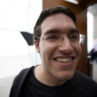 Smiling Man with Glasses