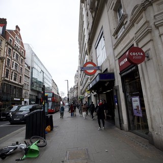 Urban Street Scene with Fallen Lime Bike in London