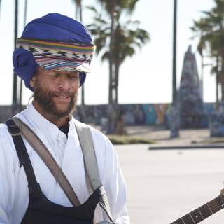 Guitar-strumming Man in Turban Amidst Palm Trees